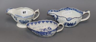 Two Worcester polychrome leaf moulded sauceboats and a similar Derby sauceboat, c.1755-65,