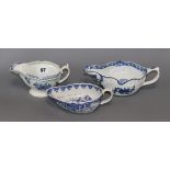 Two Worcester polychrome leaf moulded sauceboats and a similar Derby sauceboat, c.1755-65,