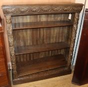 A late Victorian carved oak open bookcase W.106cm