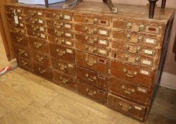 An early 20th century pine 35 drawer filing chest W.150cm