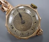 A 1920's 9ct gold wrist watch, on a 9ct expanding bracelet.