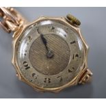 A 1920's 9ct gold wrist watch, on a 9ct expanding bracelet.