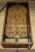 The Advance Pin Table, oak cased length 57.5cm