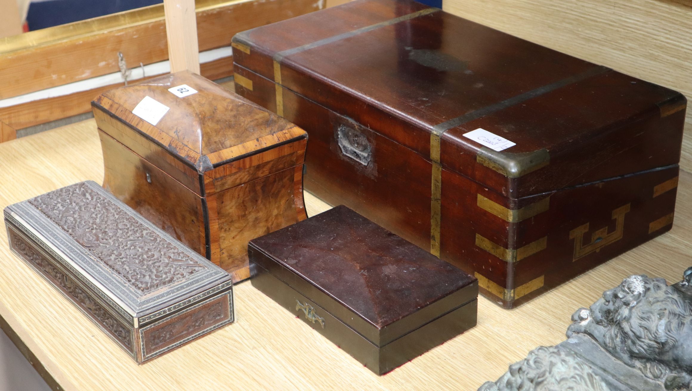 A Victorian walnut tea caddy, a writing slope and two other boxes