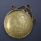 A George III 1774 gold guinea, in a yellow metal pendant mount.