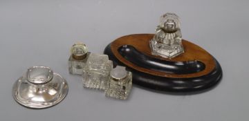 A silver capstan inkwell and four other inkwells (5)