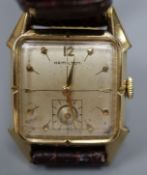 A gentleman's 10k gold filled Hamilton rectangular cased manual wind wrist watch, on later