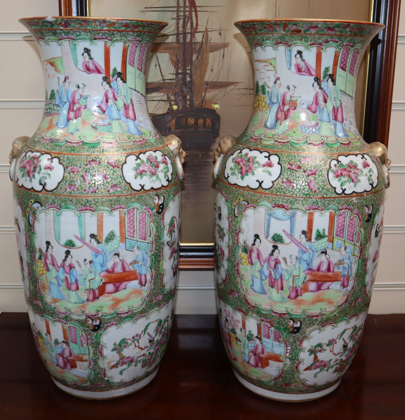 A pair of Chinese Canton-decorated famille rose vases, mid 19th century