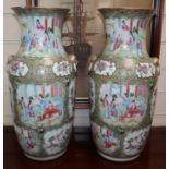 A pair of Chinese Canton-decorated famille rose vases, mid 19th century