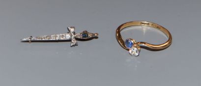 An early 20th century 18ct, two stone sapphire and diamond crossover ring and a similar sapphire and