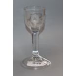 An 18th century cordial glass engraved with a rose and bird, c.1745
