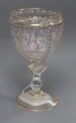 A Venetian glass goblet painted with panels of figures height 15cm