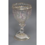 A Venetian glass goblet painted with panels of figures height 15cm