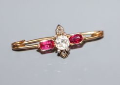 A late Victorian yellow metal, ruby and diamond cluster stick pin head, now converted to a brooch,