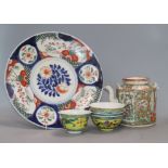 Four Chinese rice bowls, a Cantonese famille rose teapot and an Imari dish dish diameter 31cm