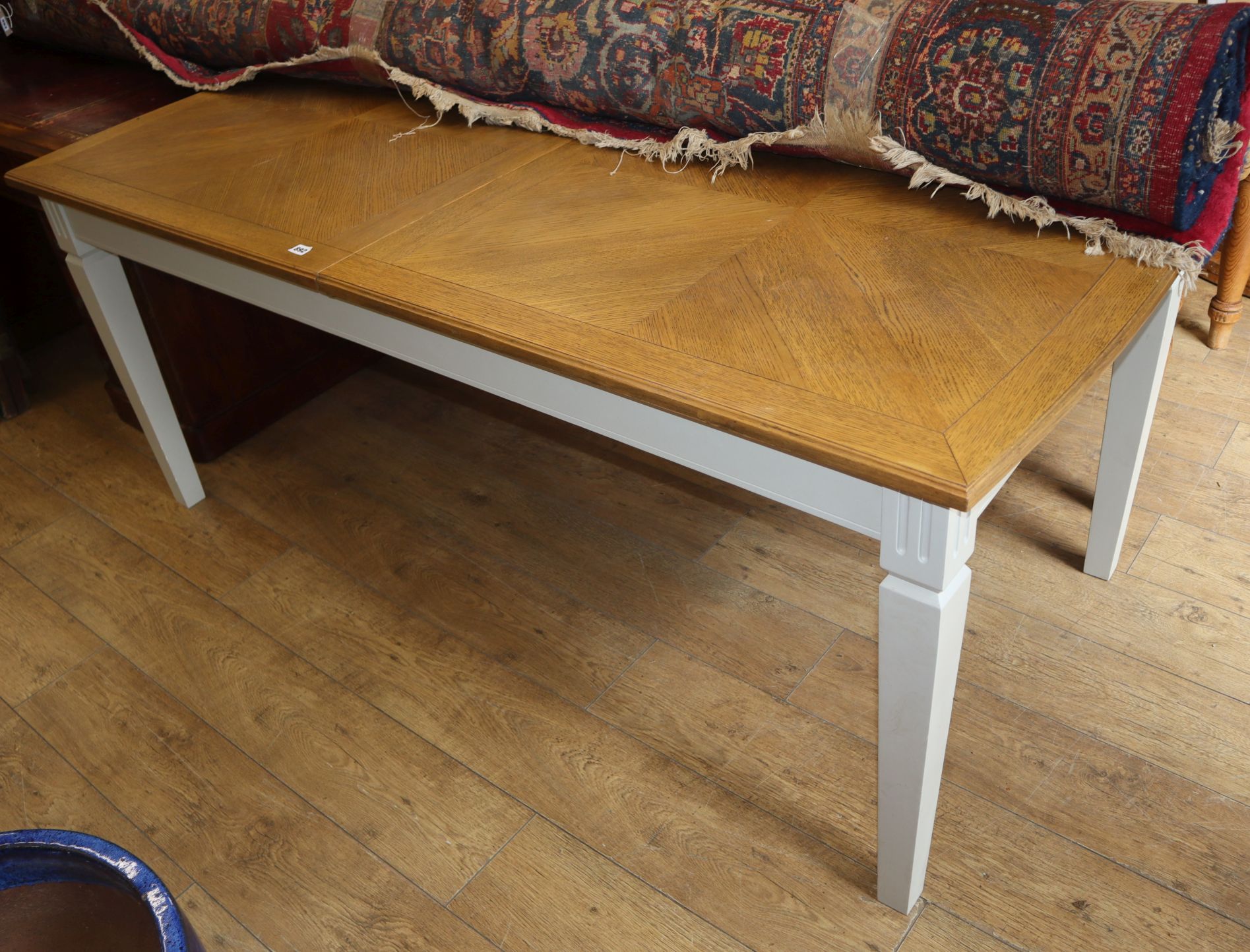 A modern oak dining table L.180cm