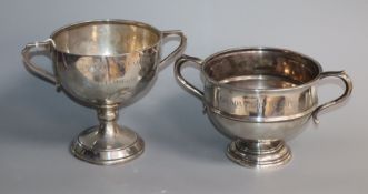 A George V silver two handled trophy bowl and a similar trophy cup, with inscriptions, 20 oz.