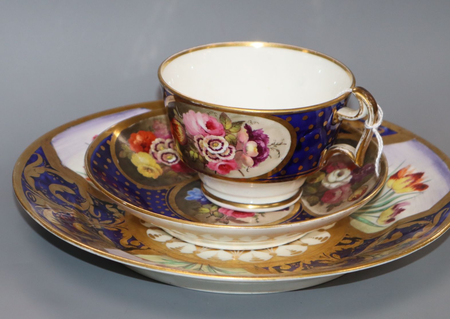 An early 19th century Swansea porcelain tea cup, saucer and plate, c.1820