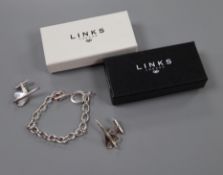 A Links of London Sterling silver Concorde charm bracelet and a similar pair of cufflinks,