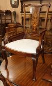 An Edwardian inlaid mahogany open armchair