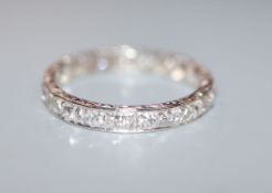 A white metal diamond set full eternity ring, size N/O.