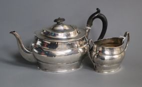 A silver teapot and matching sucrier of oval form, Sheffield 1917, makers Harrison Bros & Howson.