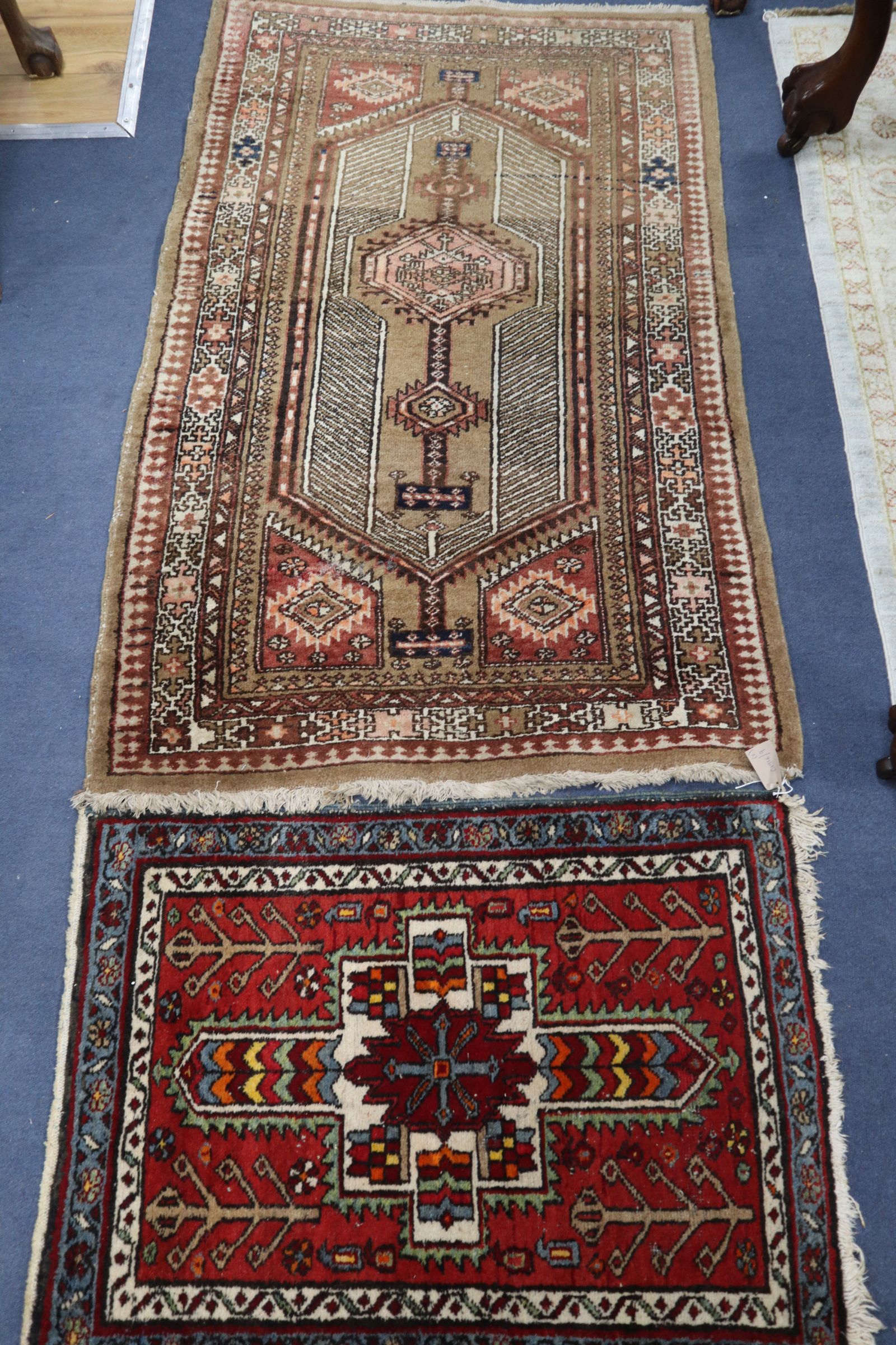 A Caucasian fawn ground rug and a geometric mat (2) 150 x 92cm and 88 x 68cm