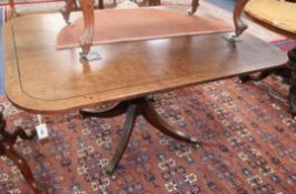 A George III mahogany and ebony strung tilt top breakfast table 143cm