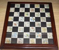 An early 20th century mahogany framed chess board, painted in watercolour with botanical studies