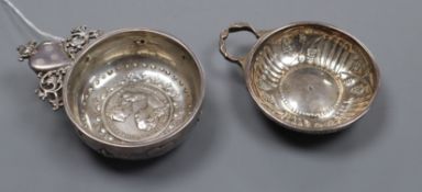 Two 19th century French white metal taste vin, one with inset coin base and flambe heart pierced