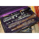 Four cased clarinets - two by Buffet and two by Boosey & Hawker