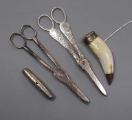 Two pairs of silver plated grape scissors, a white metal travelling corkscrew and a mounted animal