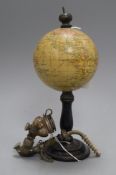 A small table globe on ebonised stand and a pipe globe height 23cm