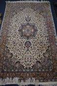 A Kashan style ivory ground rug 218 x 136cm