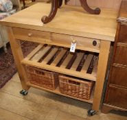 A beech framed butcher's kitchen trolley, fitted two drawers and two baskets W.90cm
