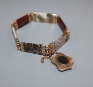 A late Victorian engraved yellow metal mounted Scottish hardstone bracelet.