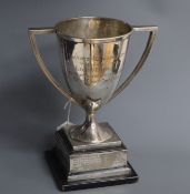 A George V silver two handled trophy cup, Glasgow, 1913, on ebonised base, 20.5cm, inscription.