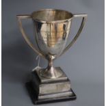 A George V silver two handled trophy cup, Glasgow, 1913, on ebonised base, 20.5cm, inscription.