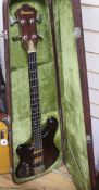 An Ibanez Musician bass guitar, left handed, in hard case