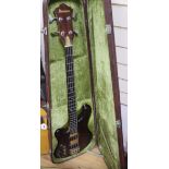 An Ibanez Musician bass guitar, left handed, in hard case