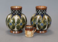 A pair of stoneware vases by J. Stiff & Sons, Lambeth and a miniature Doulton mug