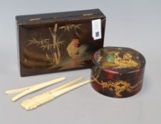 A lacquer box and two pairs of glove stretchers