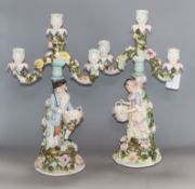 A pair of Sitzendorf figural three branch candelabra height 43cm