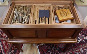 A bespoke large walnut table cigar humidor fitted numerous trays and a collection of cigars