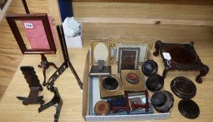 A collection of miscellaneous photograph frames and carved hardwood pot and plate stands