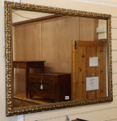 A rectangular gilt framed wall mirror Frame 100 x 75cm