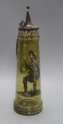 A late 19th century tapered green glass stein enamelled with a figure in period costume height 36cm