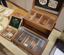 Two cigar humidors, a cigar display case, two cigar boxes and a quantity of cigars