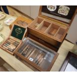 Two cigar humidors, a cigar display case, two cigar boxes and a quantity of cigars