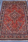 A North West Persian brick red ground rug 202 x 139cm
